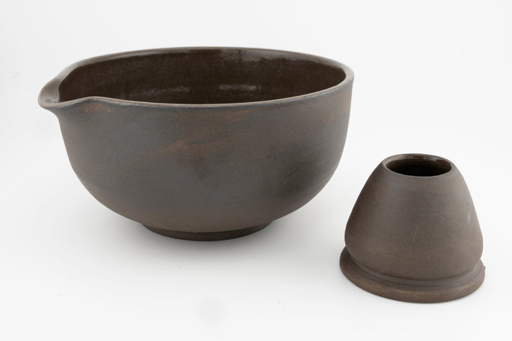 Brown stoneware matcha bowl with matching conical whisk holder