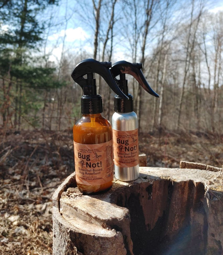 Bug Not plant-based insect repellent spray bottles with black trigger sprayers, amber liquid