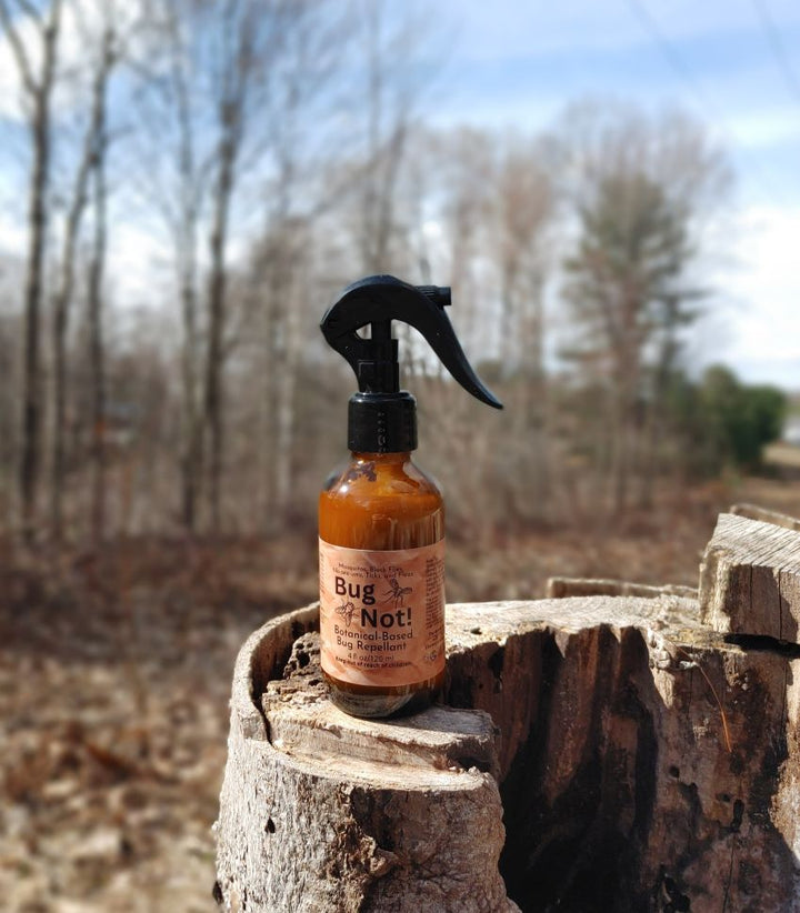 Bug Not plant-based insect repellent spray bottle with black trigger sprayer, amber liquid