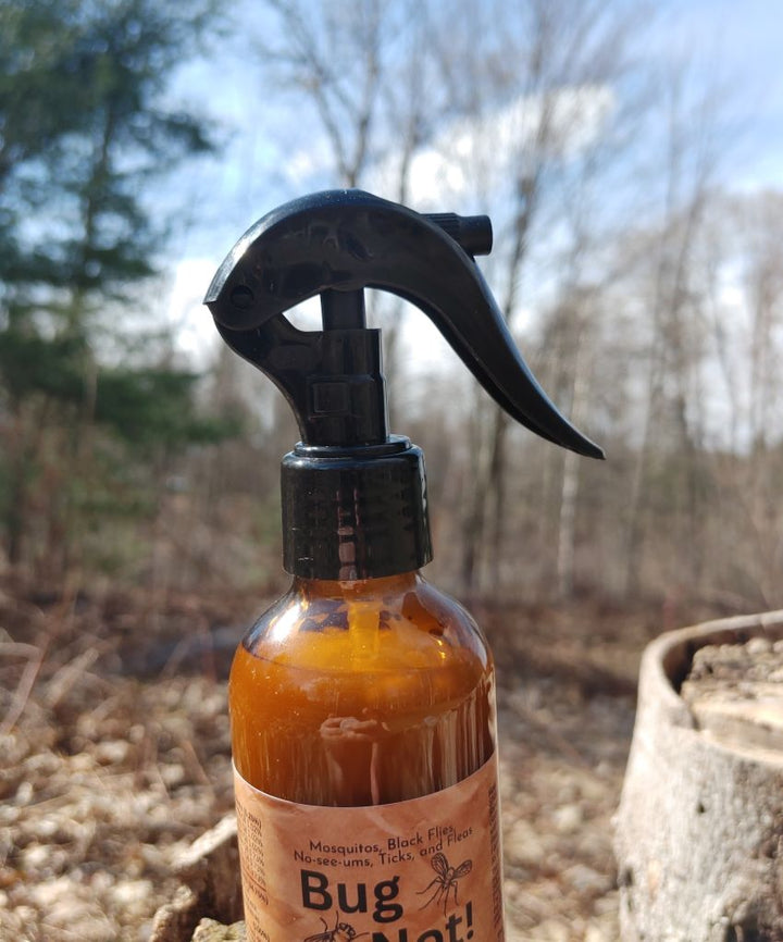 Bug Not plant-based insect repellent spray bottle with black trigger sprayer, amber liquid