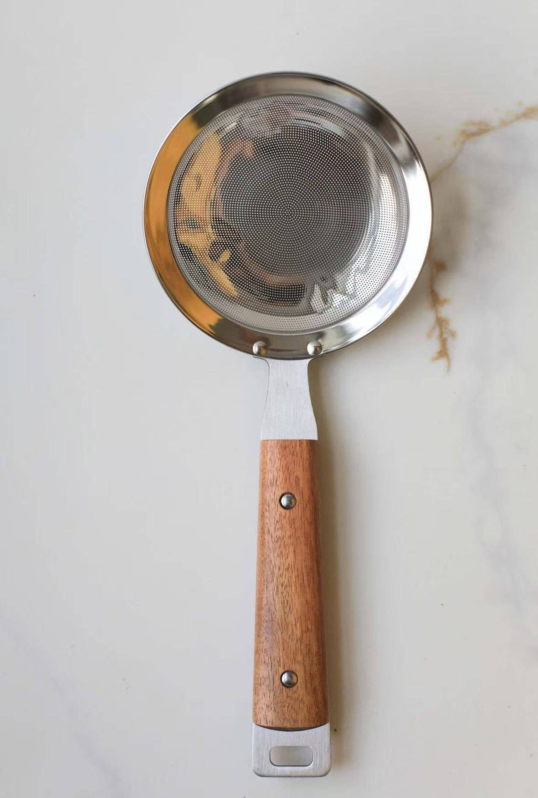 Round mesh strainer with silver mesh insert and wooden handle, hanging loop