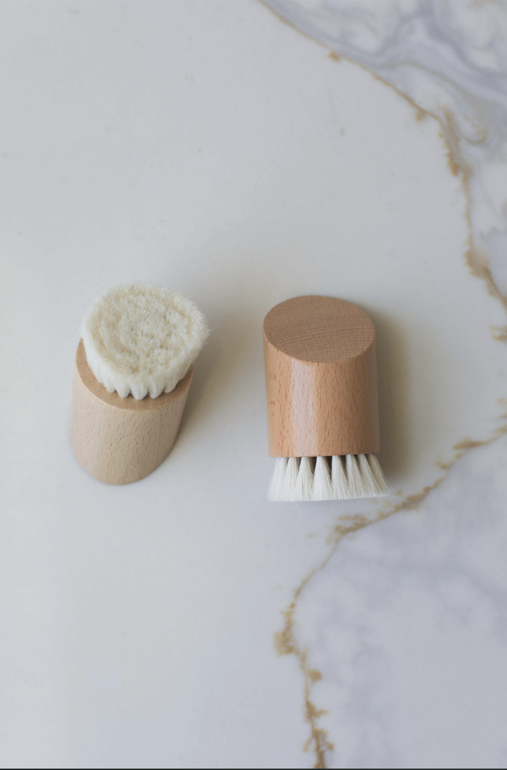 Two face brushes with wooden caps and white bristle heads