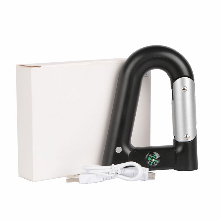 Black carabiner power bank with included USB cable and retail box packaging