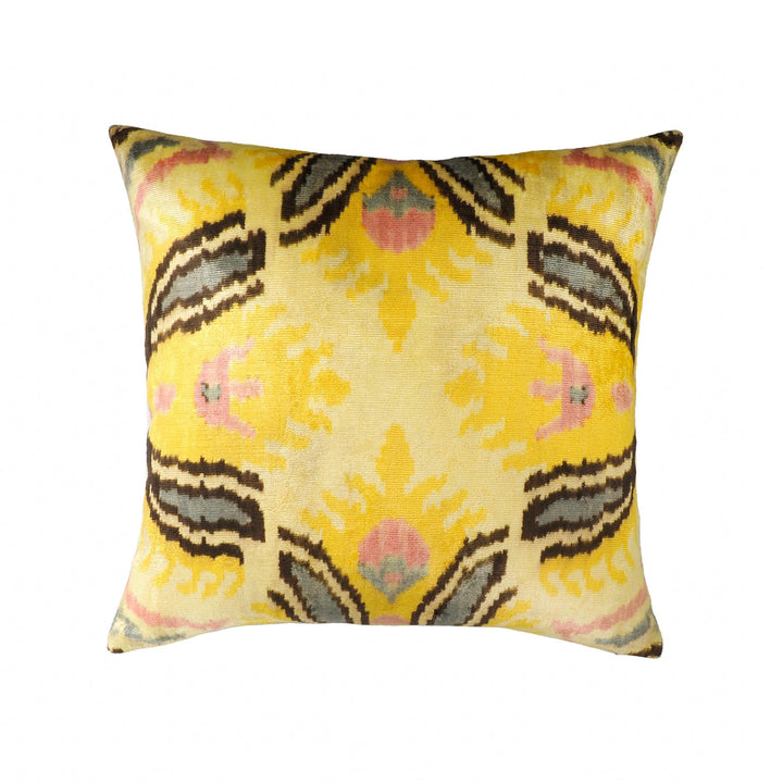 Silk velvet throw pillow cover with yellow, pink, and black ikat pattern