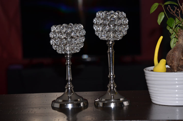 Two silver beaded crystal hurricane candle holders on round weighted bases