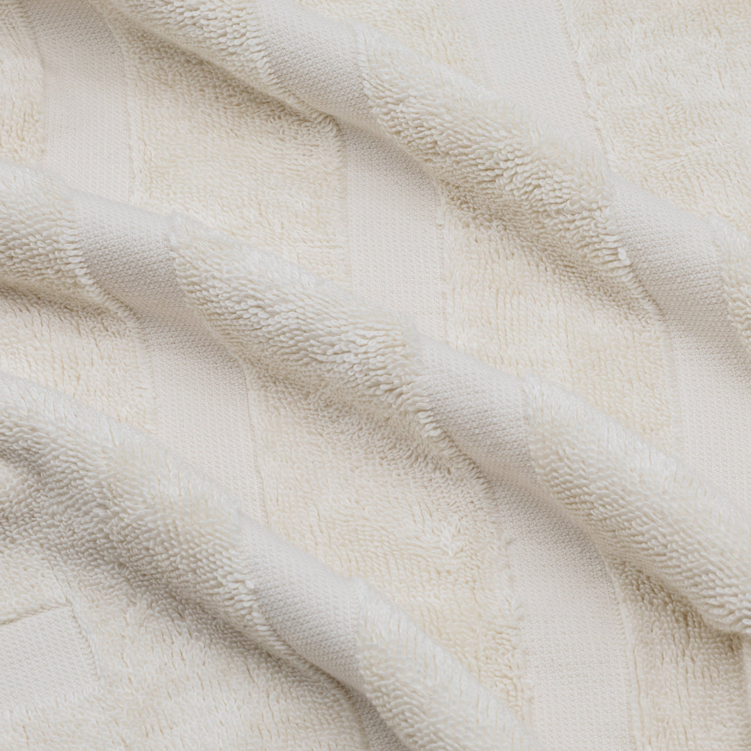 Close-up of white cotton towel weave with raised textured pattern