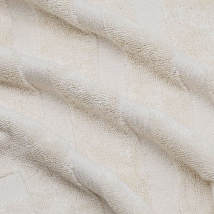 Close-up of white cotton towel weave with raised textured pattern