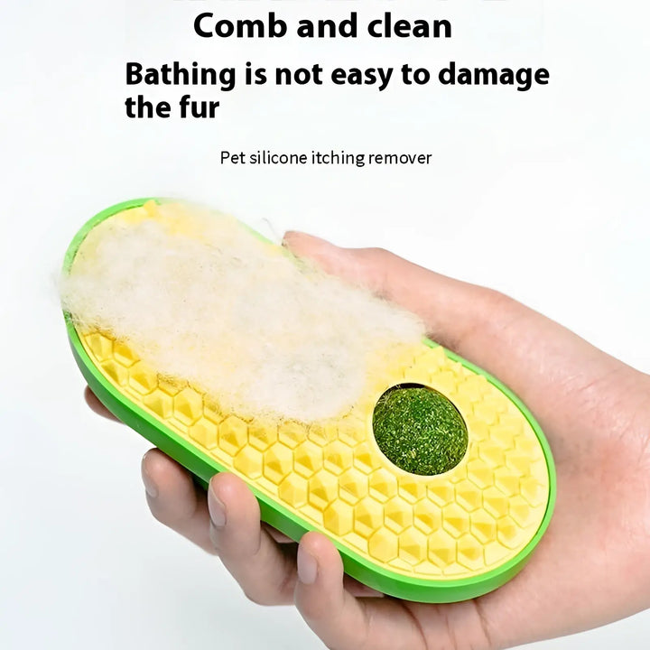 Cat self-grooming silicone brush in hand, green frame with yellow honeycomb surface