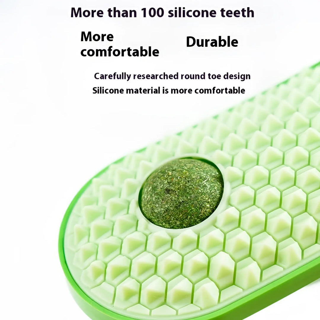 Cat self-grooming silicone brush close-up, light green honeycomb texture with green pad