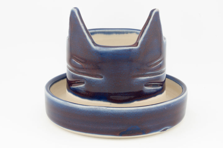 Dark blue cat-shaped planter with matching saucer, glossy glaze