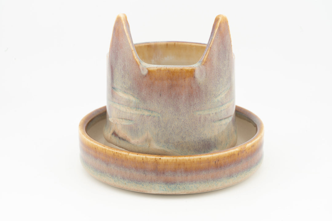 Cream and light blue cat-shaped planter with circular saucer, glazed ceramic
