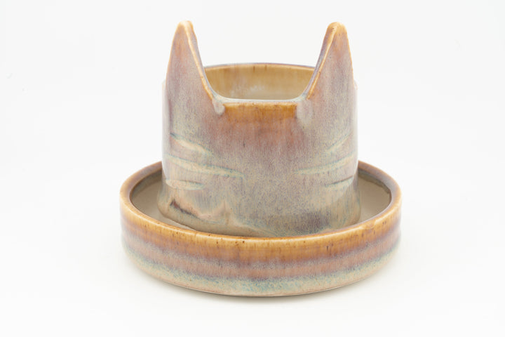 Cream and light blue cat-shaped planter with circular saucer, glazed ceramic