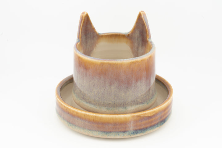 Light blue-gray cat planter cup with round saucer base, glazed ceramic