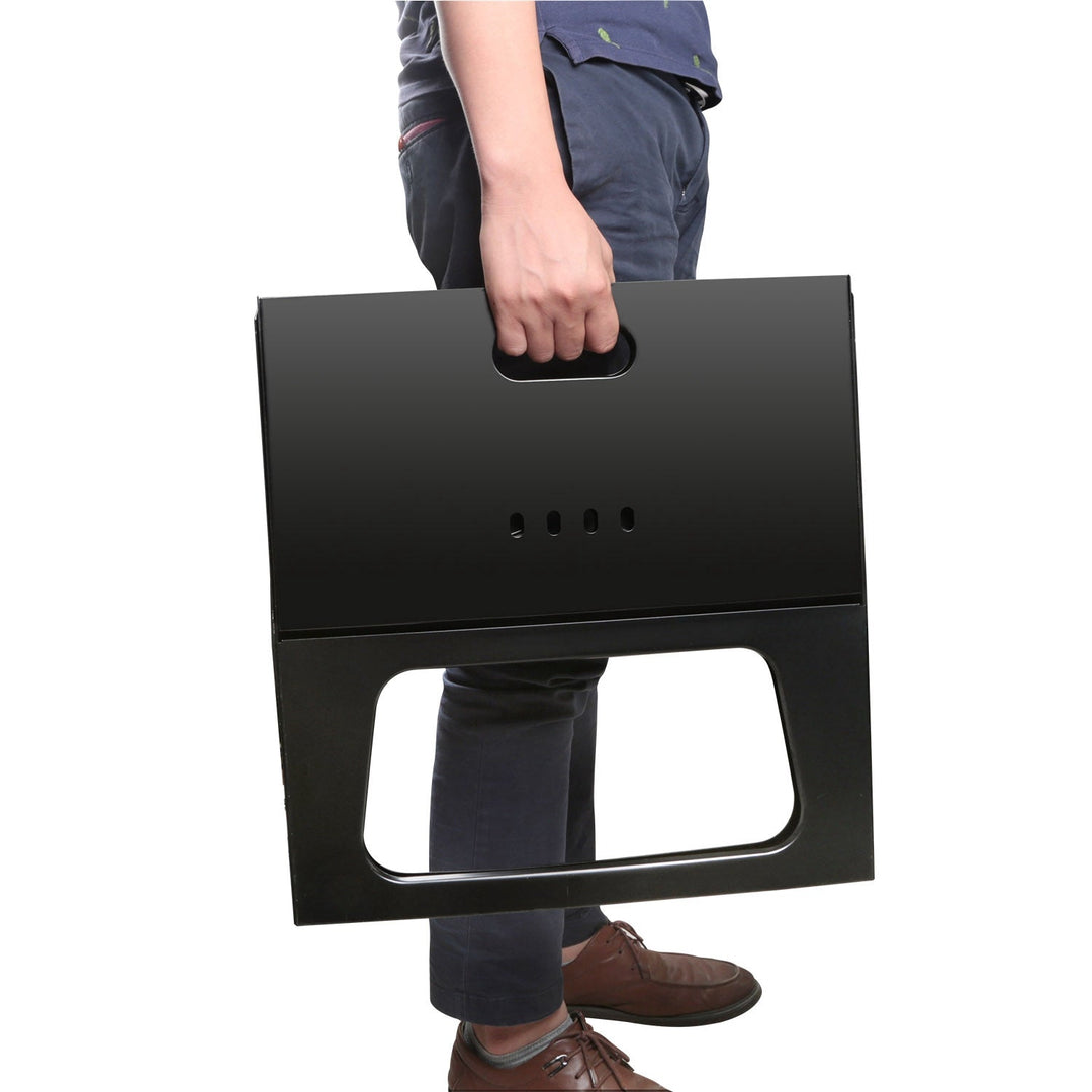 Portable charcoal grill folded flat with large cutout handle, black