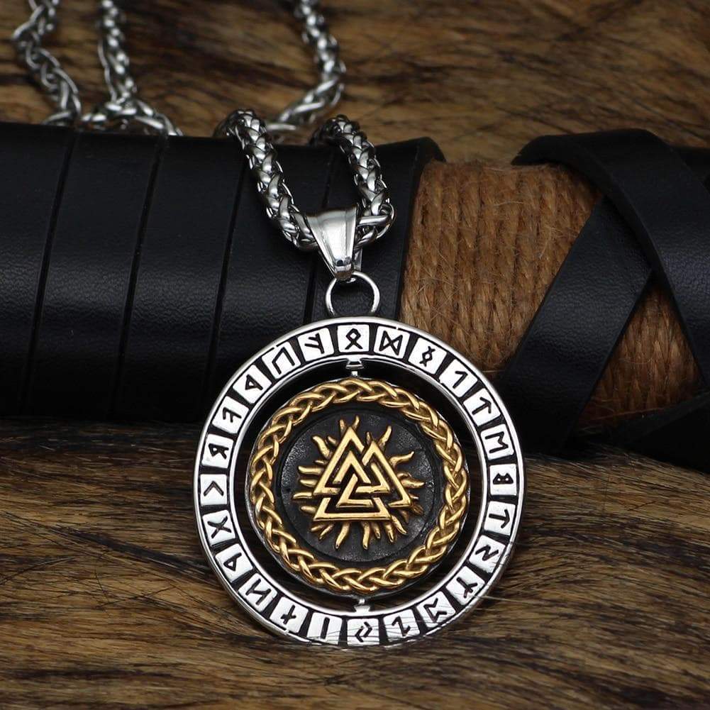 Stainless steel rune pendant necklace with round medallion, gold braid ring, dark center.