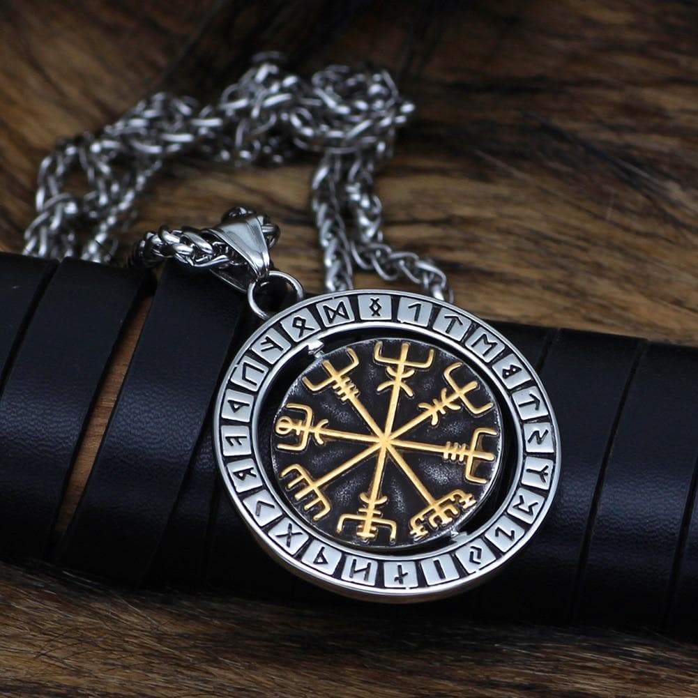 Stainless steel rune pendant necklace, round medallion with gold symbol lines on dark center.