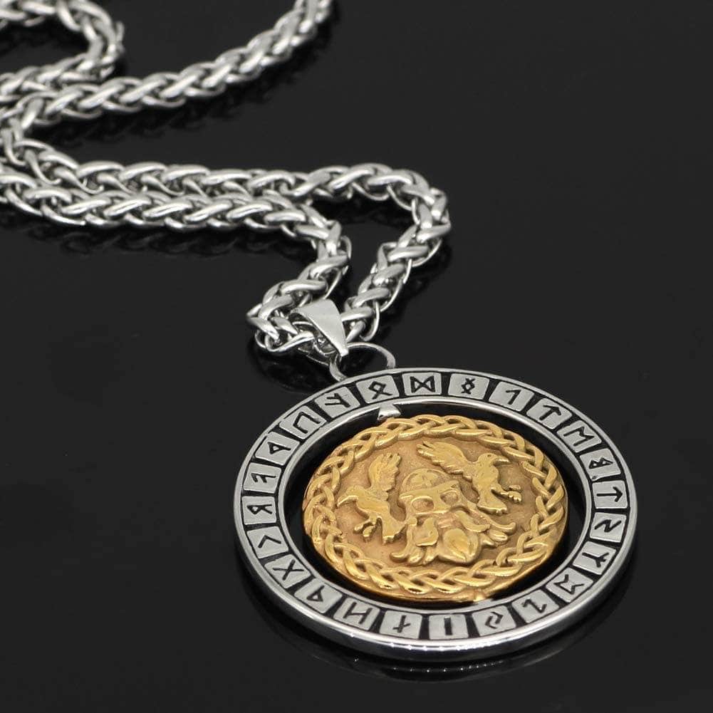 Close-up of oval rune pendant necklace with gold-toned Odin figure coin on silver frame