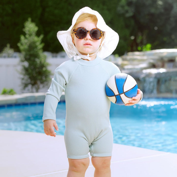 Mint ribbed long-sleeve swim romper with snap front and short legs for toddlers