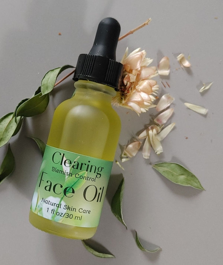 Green face oil bottle with black dropper, clear label for acne control