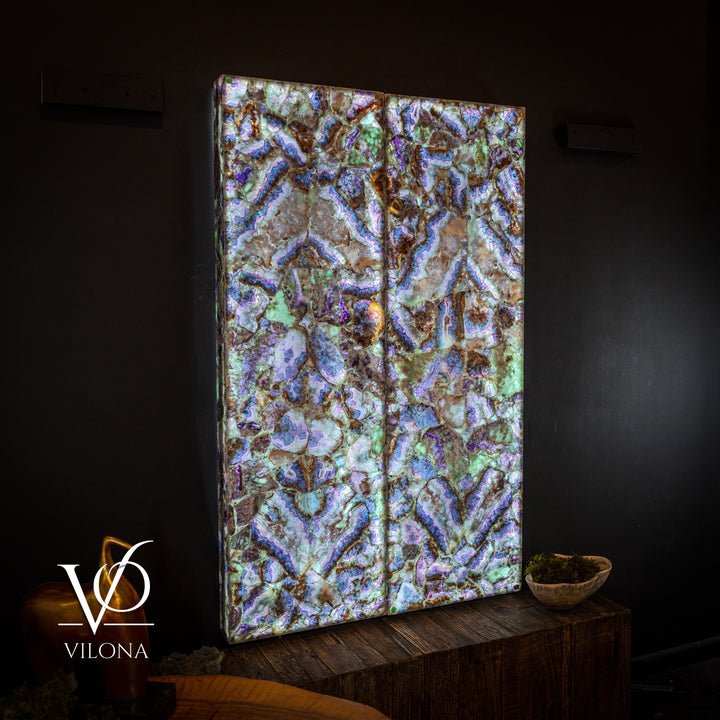 Framed fluorite crystal wall panel showing iridescent blue, green, and gold mosaic details