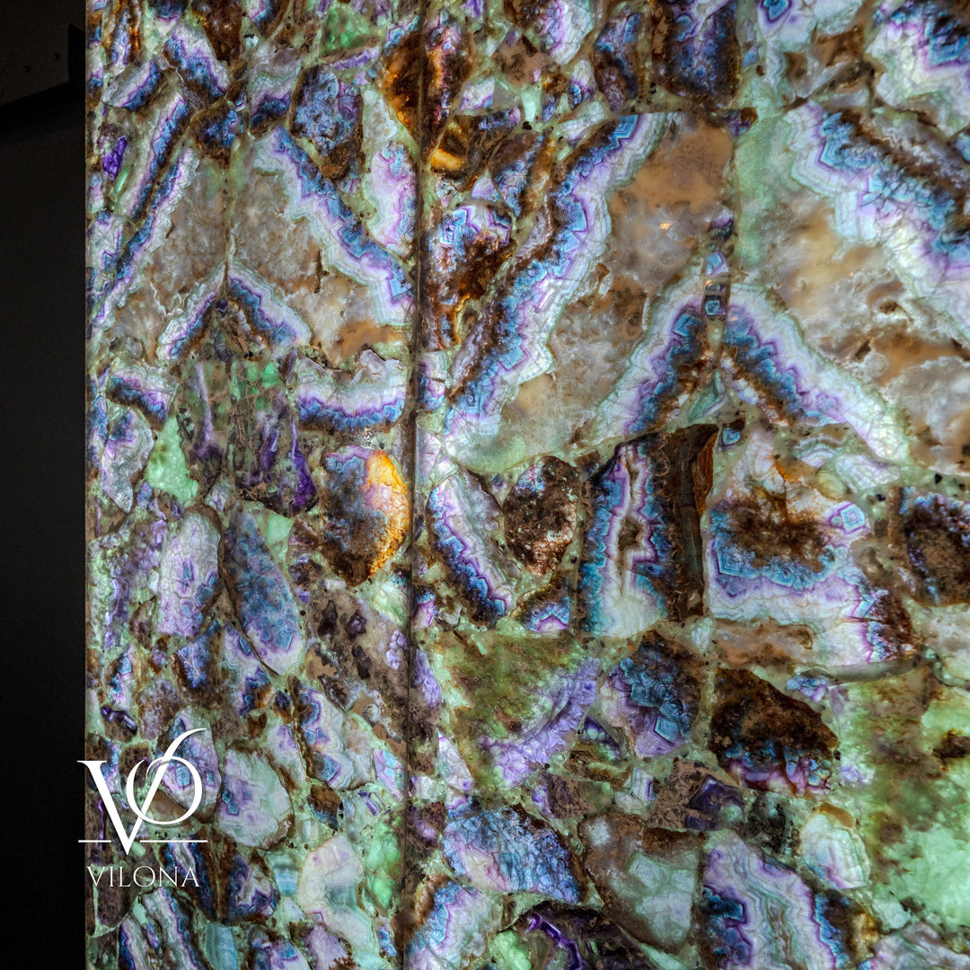 Fluorite crystal wall panel with mottled green-gold stone and electric blue veining