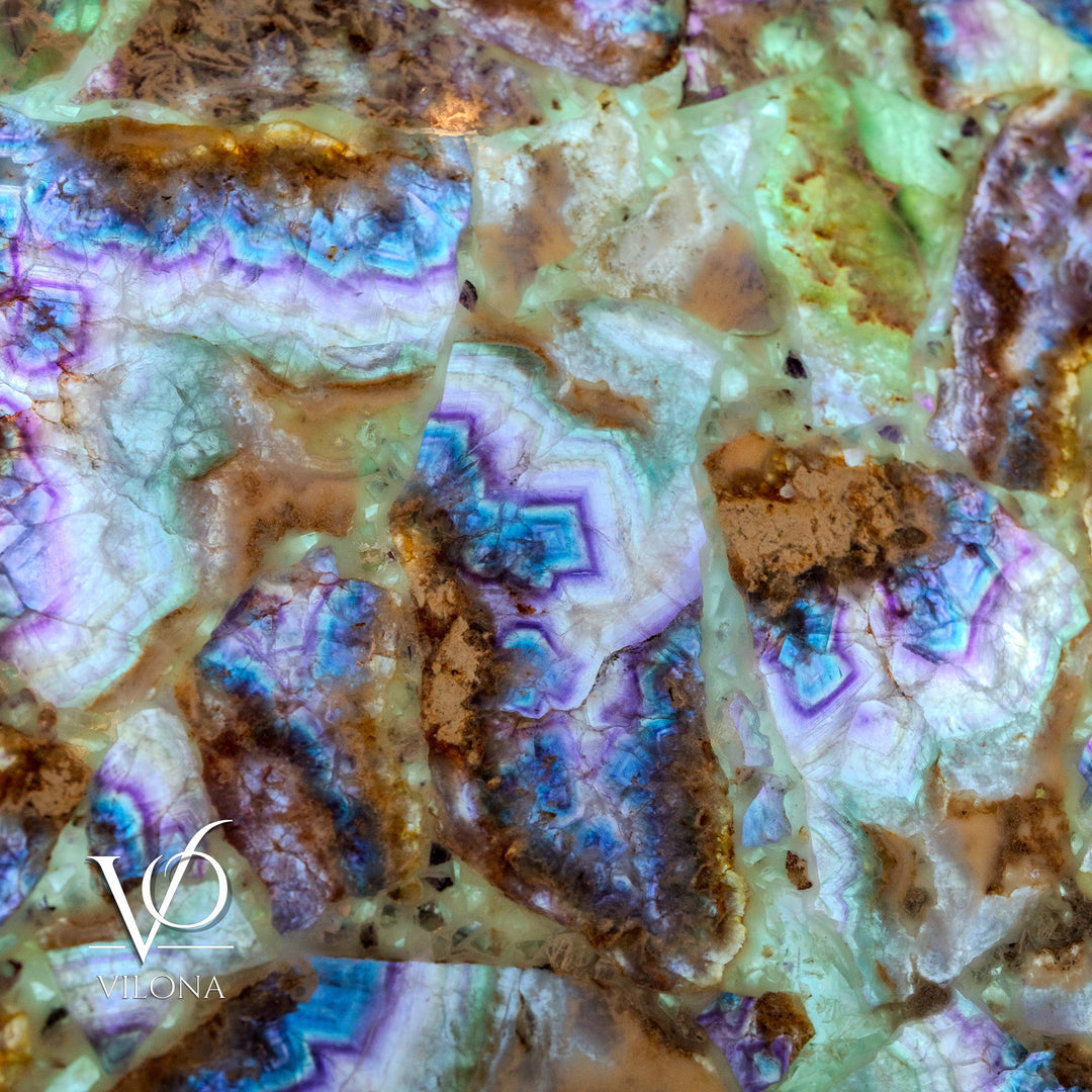 Fluorite crystal wall panel close-up of translucent stone with blue and purple ripple lines