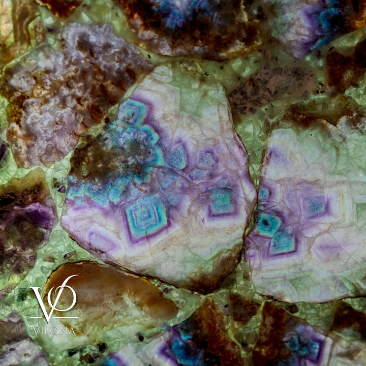 Fluorite crystal wall panel showing pale green base with purple-blue geometric fractures