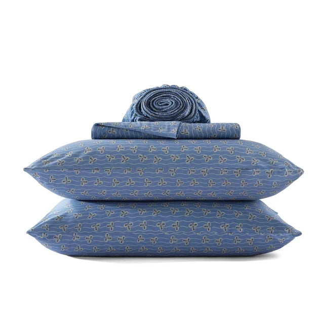 Cotton jersey sheet set, blue with small leaf motif, folded stack with rolled top