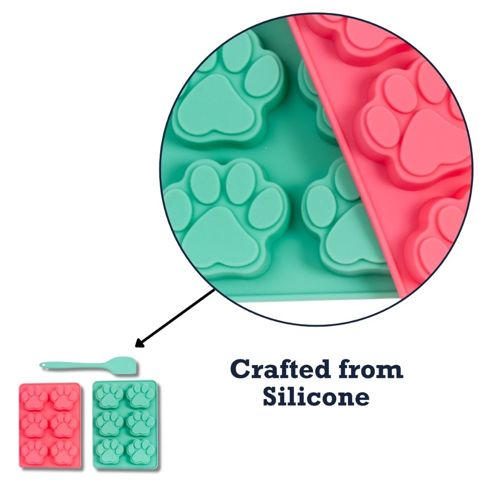Close-up of silicone paw-mold cavities in teal tray and pink tray