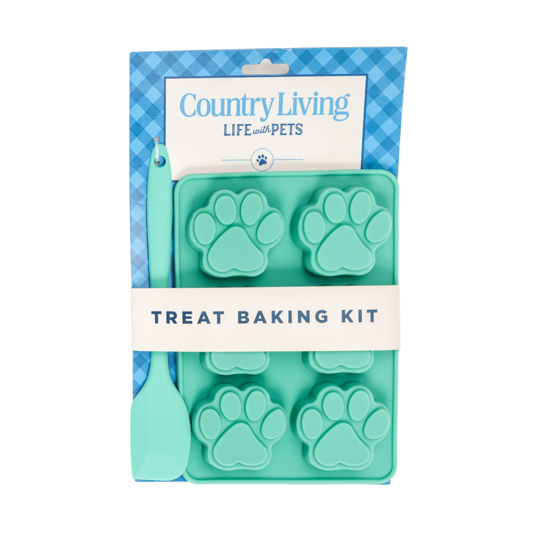 Silicone dog treat baking kit with teal paw-mold tray and turquoise spatula, boxed
