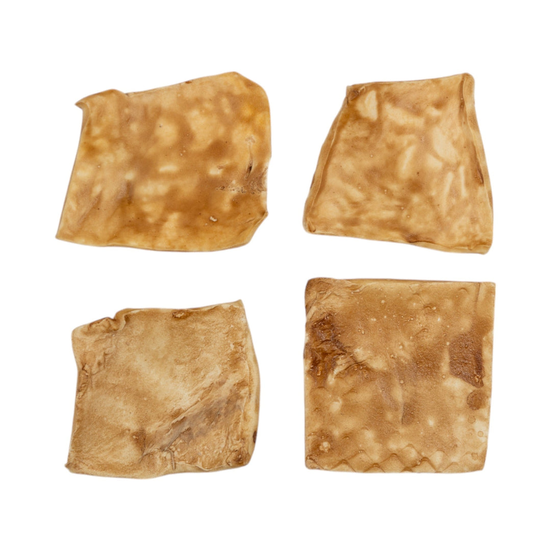 Beef cheek dog chew pieces, light brown, four-piece assortment