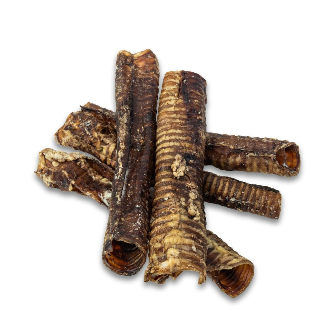 Stacked beef trachea dog treats, ridged curled pieces