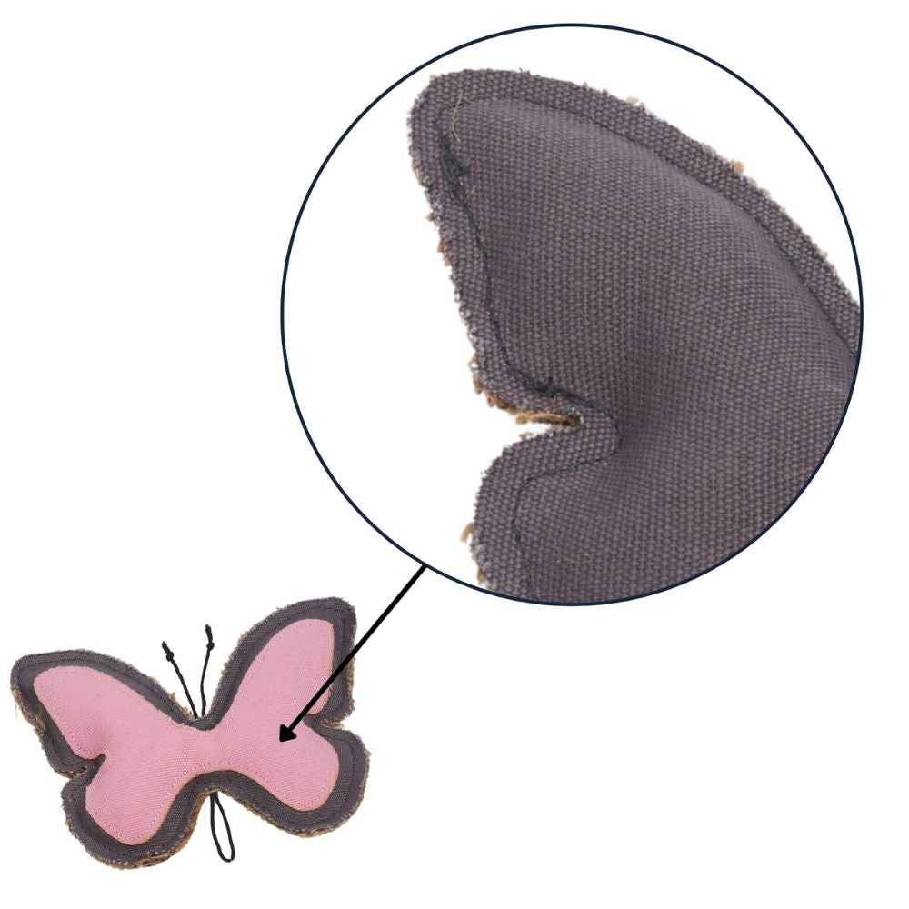 Butterfly-shaped dog chew toy close-up of dark fabric wing texture and stitched edges