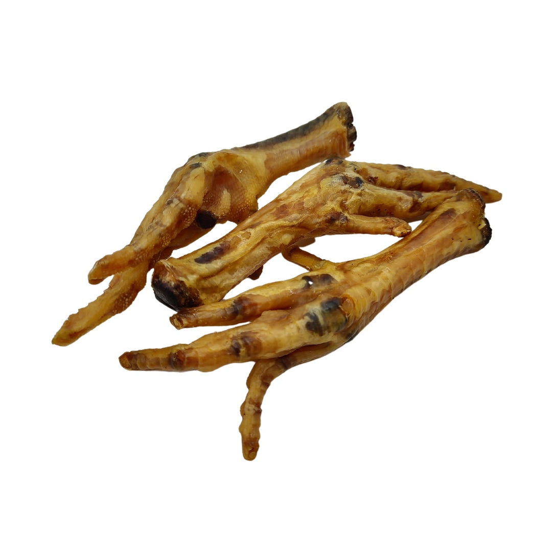Bundle of dried chicken feet dog treats, light tan with dark tips