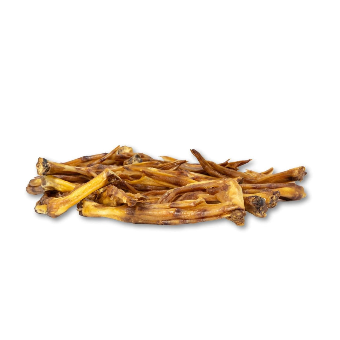 Duck foot dog treats, assorted dried chew strips and pieces