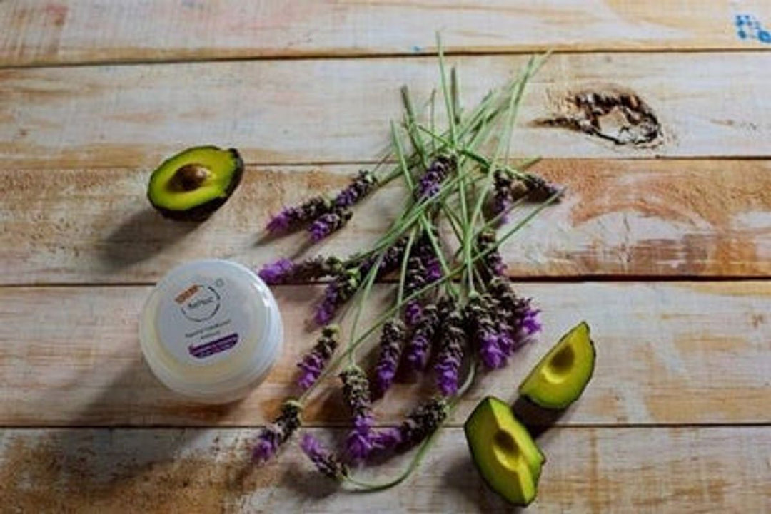 BeNat natural deodorant cream jar on wooden surface with lavender stems