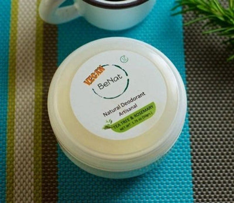 Vegan natural deodorant cream jar with BeNat label on teal fabric