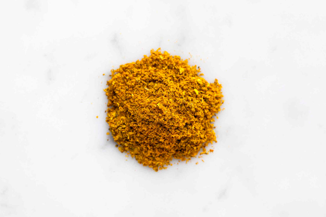 Ground curry spice powder in a small mound