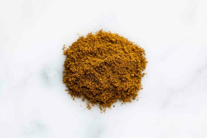 Turkish curry ground spice powder, fine golden-brown seasoning.
