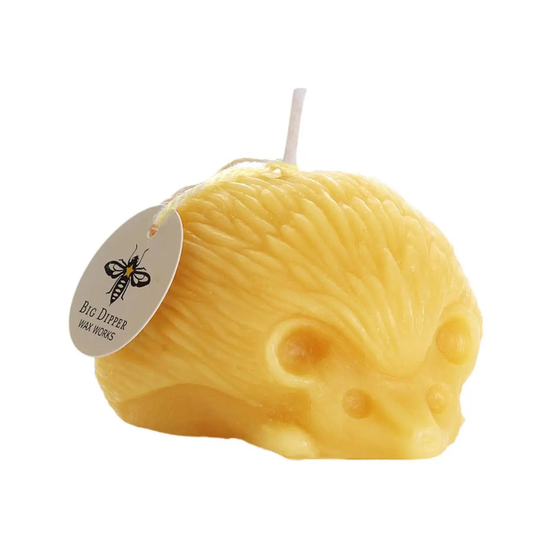 Hedgehog beeswax candle, yellow honey color with wick and small label tag