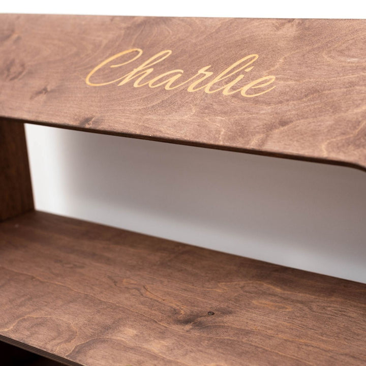 Wood dollhouse bookcase shelf detail with cursive personalization "Charlie"