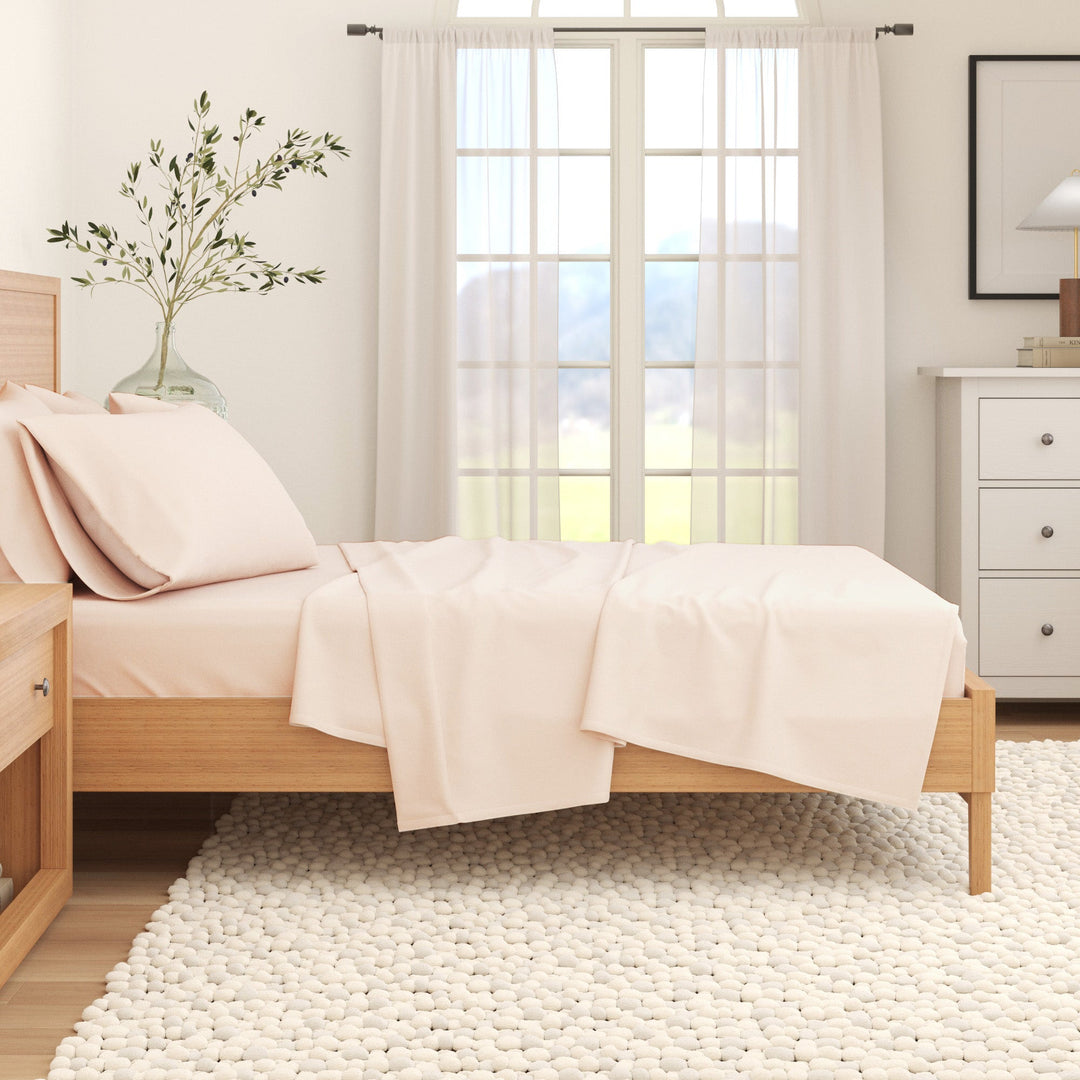 Off-white cotton flannel sheet set on bed with pillowcases
