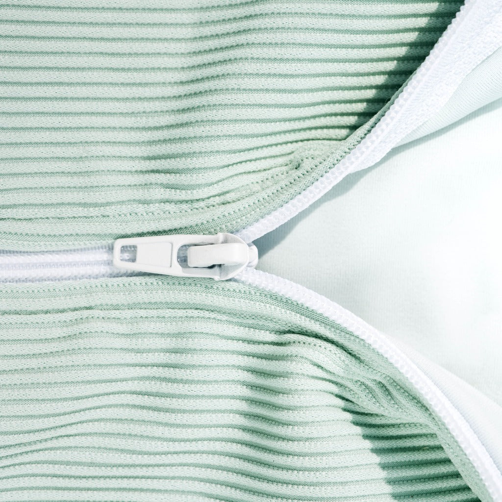 Mint ribbed rash guard neckline with white trim and front fastening tab