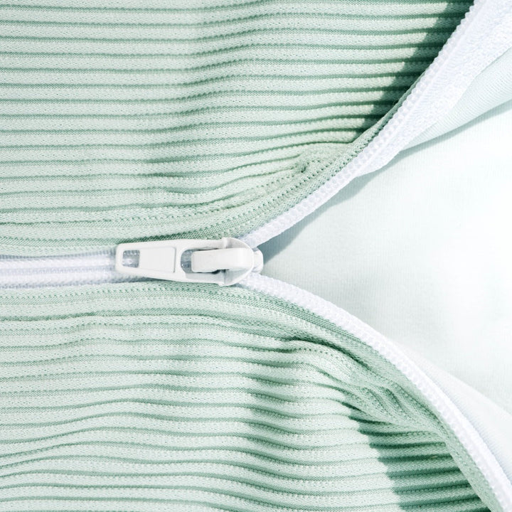 Mint ribbed rash guard neckline with white trim and front fastening tab