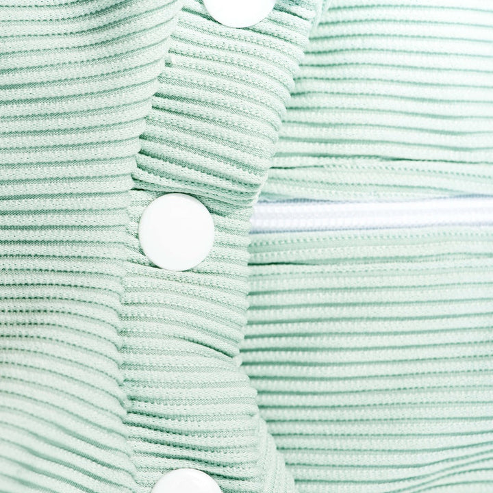Mint ribbed swim romper front with white snap buttons and high neck opening