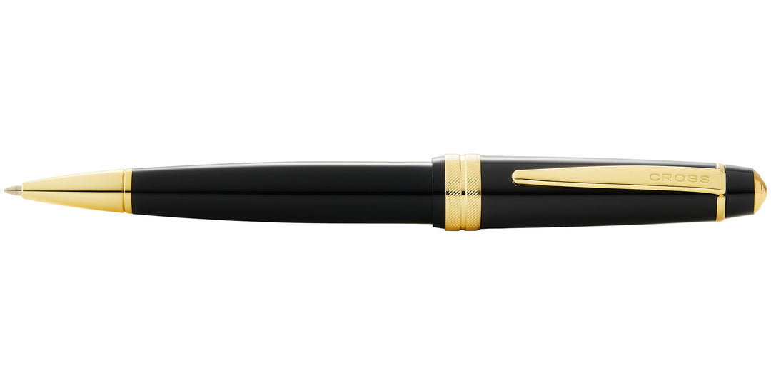 Black resin ballpoint pen with gold tip and 'CROSS' logo on barrel