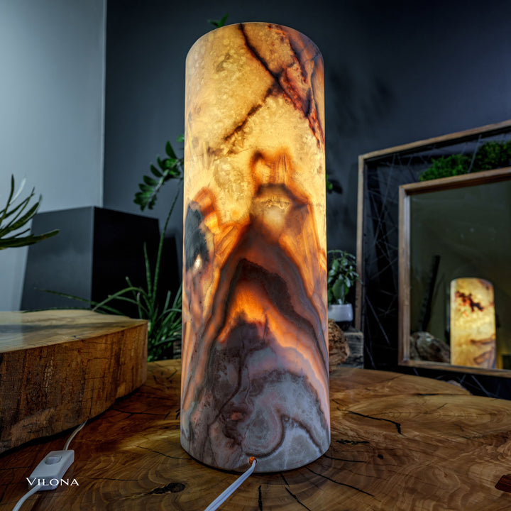 Onyx table lamp cylindrical shade with mottled amber marbling, lit glow