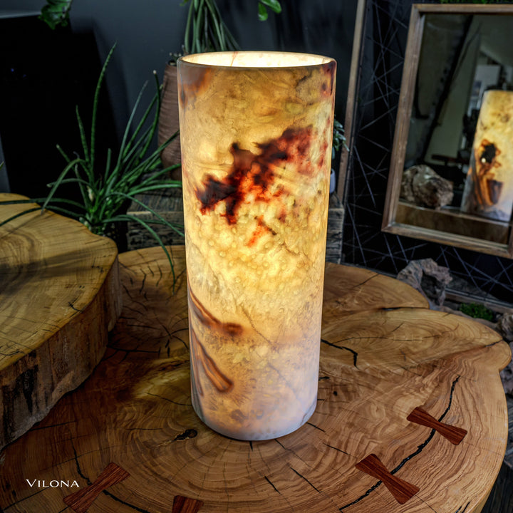 Onyx table lamp cylindrical shade, soft amber illumination, marbled pattern