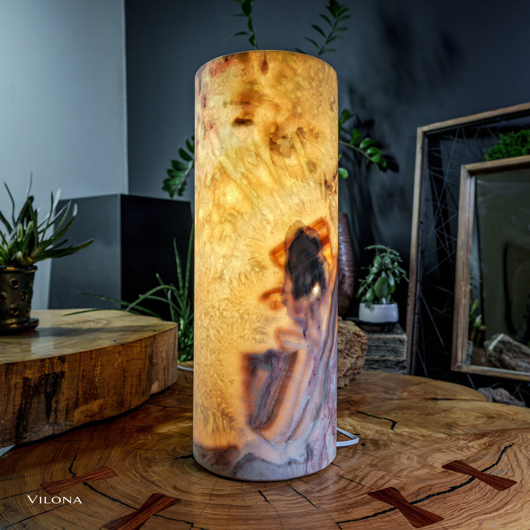 Onyx table lamp cylindrical shade with bright amber interior, dark streak accents