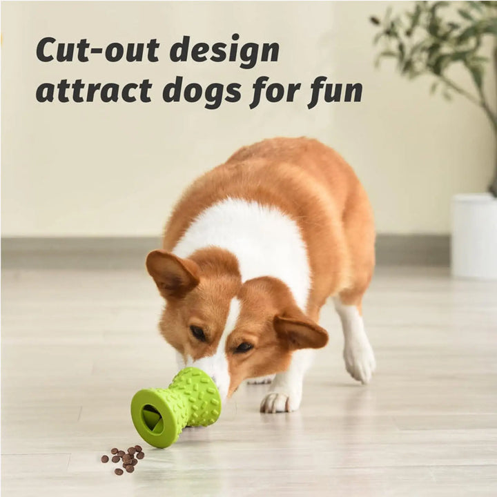 Green textured rubber dog chew toy with hollow end; small dog sniffing